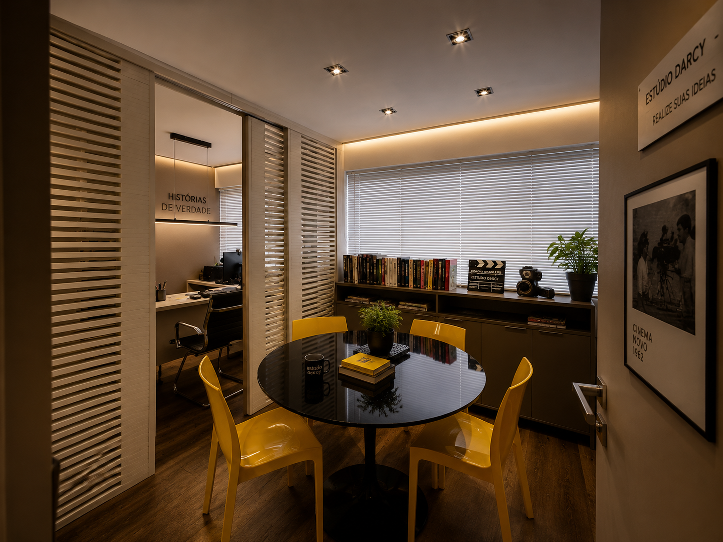 Sala de reunião — mesa redonda e biblioteca curada